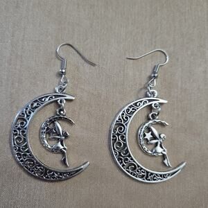 Fairy sitting on moon silver tone filigree earrings